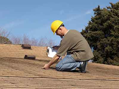 roof leak inspection near damaged roof section